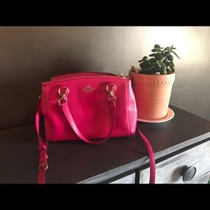 Pink/Ruby Coach small to medium satchel.